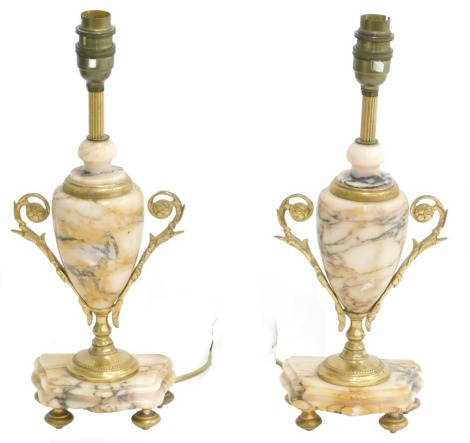 A pair of late 19th/early 20thC clock garniture urns, each with gilt metal handles, converted to table lamps, 44cm high.