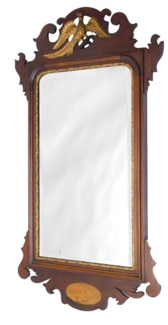 A 19thC mahogany and parcel gilt wall mirror, with fretwork frame, Hoho bird surmount and shell oval inlay to base, 90cm high.