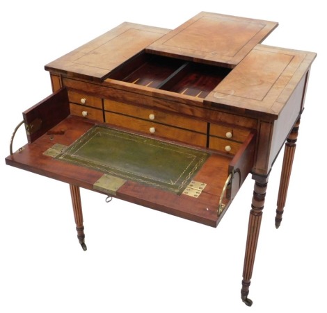 A Regency mahogany games/writing table in Gillows style, the sliding top revealing a backgammon board, above a fitted secretaire writing slope, on reeded legs, 75cm wide.