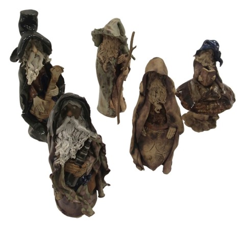 Five studio pottery figures, of cloaked wizards, the largest 31cm high.