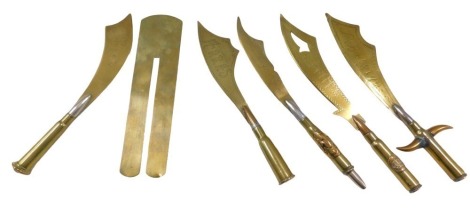 Five brass trench art shell cases, converted to letter openers, some bearing inscriptions.