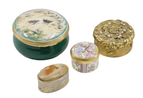 A Crummles enamel box, Happy Birthday, a Halcyon Days limited edition box, decorated with woodcock, number 37/50, a gilt metal box with simulated pearl top, and an onyx and silver coloured box. (4)