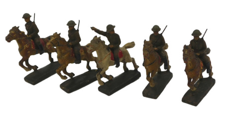 A group of Lineol German soldiers and horse figures.