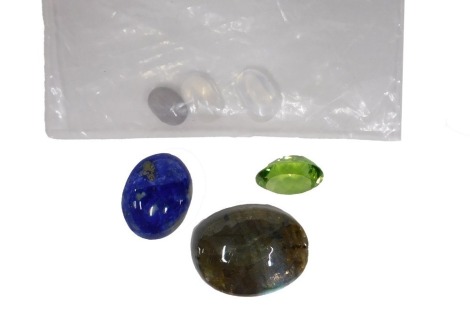 A quantity of loose gemstones, to include an oval cabochon labradorite, 19.7mm x 15.6mm x 6.8mm, an oval mixed cut intense saturation peridot, 11mm x 8.93mm x 5.58mm, an oval cabochon lapis lazuli, 14.45mm x 11.4mm x 4.4mm, and three moonstones. (6)