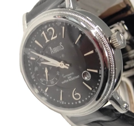 An Arbutus gent's fashion watch, with black finish dial and seconds dial, with open work automatic movement to back, on black leather strap, 3.5cm diameter, boxed.