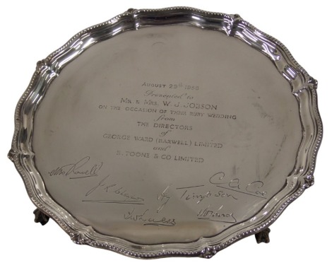 A Victorian silver salver, with beaded and fleur de lys border, bearing the inscription, dated 1958 and bearing signatures, from the directors of George Ward Barwell Ltd, London 1899, 17.5oz.