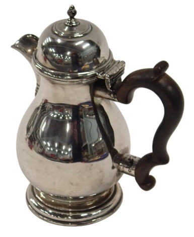 A George V silver coffee pot, with an ebonised handle, turned acorn knop top, bearing inscription presented to Mr & Mrs W J Jobson August 29th 1958, London 1913, 12.18oz.