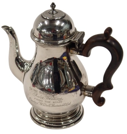 A George V silver coffee pot, with an ebonised handle, turned acorn knop top, bearing inscription presented to Mr & Mrs W J Jobson ?; on the occasion of their Ruby Wedding from George Ward, London 1913, 12.91oz.