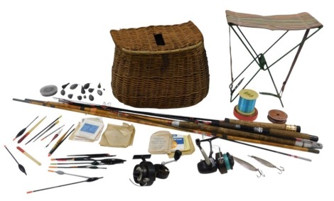 A wicker fishing creel and other fishing tackle and rods, the creel with leather strap, and two spinning rods, and a bamboo three piece rod, a Cap fixed spool reel, and another, various floats and other tackle, etc., including a folding stool.