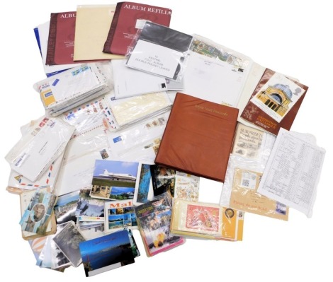 Stamps.- a small quantity of ephemera to include an empty album and refill album pages