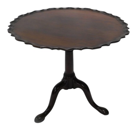 A 19thC plum pudding mahogany tilt top supper table, the circular top with a piecrust edge, on turned column with bird cage, on tripod base with pad feet, 79cm diameter.