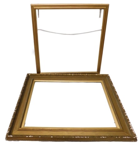 A gilt gesso picture frame, with moulded decoration of leaves, 125cm high, 149cm wide, and a moulded gilt frame, 119cm x 122cm.