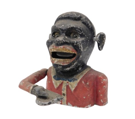 An aluminium money box, modelled in the form of a male figure painted in black with red coat or jacket, 15cm high.