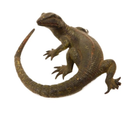 An early 20thC Austrian cold painted bronze lizard, painted in green, etc., in the manner of Bergmann, 7cm long.