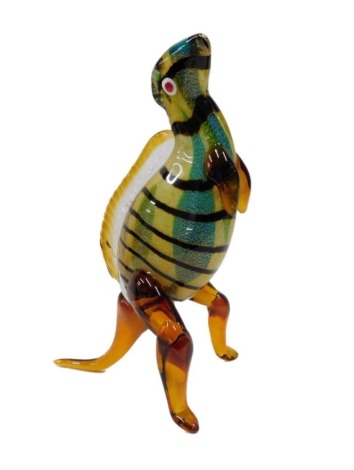 A Murano type glass figure of a standing dinosaur, in shades of green, brown, amber, etc., 40cm high.