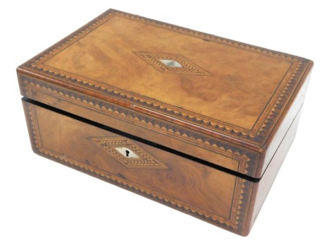 A Victorian walnut and parquetry writing box, the hinged lid with engraved mother of pearl cartouche, enclosing a fitted interior, 35cm wide. (AF)