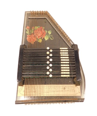 An ebonised zither, in outer case, boxed, 52cm long. (AF)