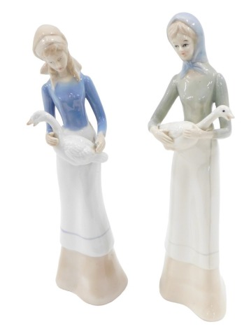 Two Spanish porcelain figurines, each modelled in the form of a lady with a goose, unmarked, 28cm high.