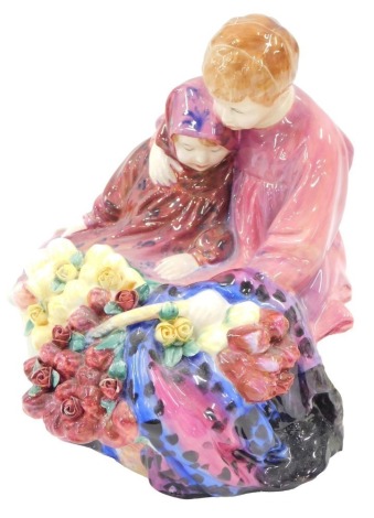 A Royal Doulton figure group Flower Seller's Children, printed mark to underside, 20cm wide.