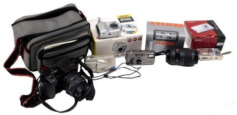 Various model cameras, comprising Nikon Coolpix 3100, a Casio Exilim, a Pantex F70 lens, a Kodak Avanti XI, Olympus GF, and a Pentax SFX and 28-80 lens. (1 box)