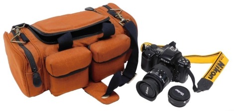 A Nikon F601 camera, and AF Nikon 35105mm lens, and additional filter, in material carry case.