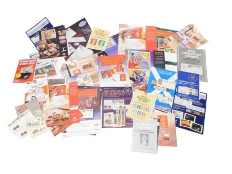 Philately. Royal Mail first day covers, Christmas stamp programmes, various advertising Christmas stamp posters, etc. (1 box)