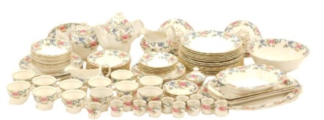 A Royal Doulton Boothes Flora Dora pattern part tea and dinner service, comprising oval meat plate, rectangular meat plate, tureen, bowl, two tureen lids, various dinner plates, teapot, coffee pot, gravy boat, egg cups, teacups, etc. (4 trays)