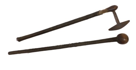 An African tribal axe, with long metal bound handle, 62cm high, and a similar knobkerrie, 69cm high. (2, AF)