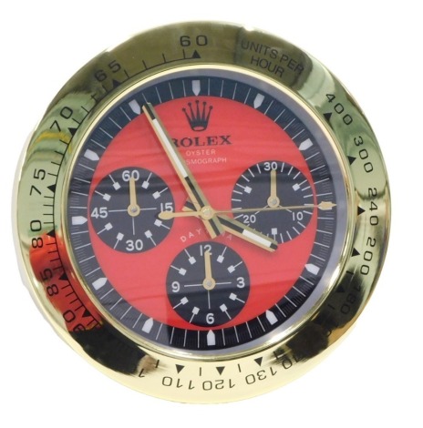 A replica Rolex Oyster Perpetual advertising clock, with red dial, 35cm diameter.