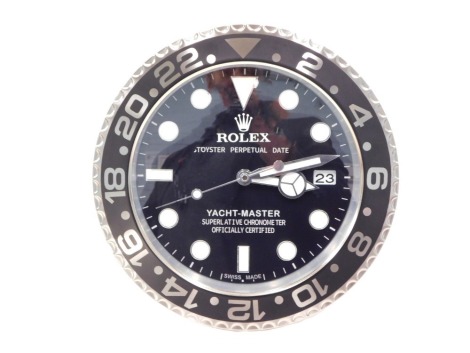 A replica Rolex Oyster Perpetual advertising clock, with black dial, 35cm diameter.