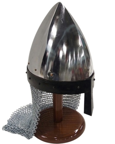 A John Barnett carbon steel replica armour helmet, with chain meshed back, arch top, 40cm high on the stand.