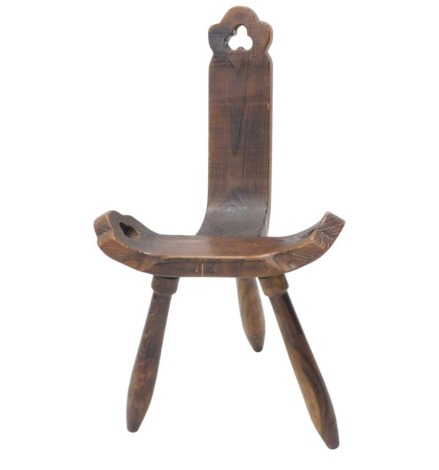 A Spanish stained pine birthing chair, with pierced trefoil decoration on turned legs.