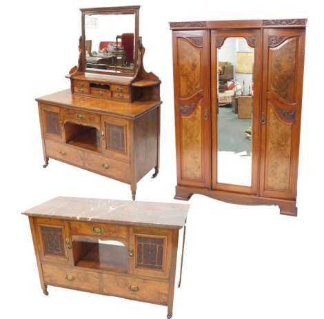 A late Victorian associated walnut and burr elm bedroom suite, comprising walnut wardrobe with central mirrored panel, flanked by two doors, each with figured panels on bracket feet, 202cm high, 149cm wide, an associated wash stand, with red marble top, a