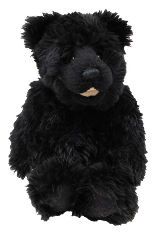 A black Charlie Bear, with label, 43cm high.