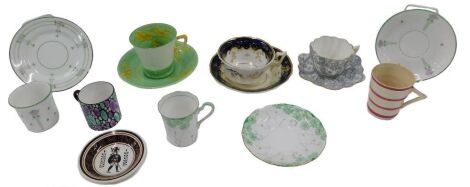 A small group of cups, saucers and coffee cans, including Art Deco design, cup and saucer with buttercup designs by Collingwood, a 19thC Rockingham style cup and saucer, and others. (1 tray)