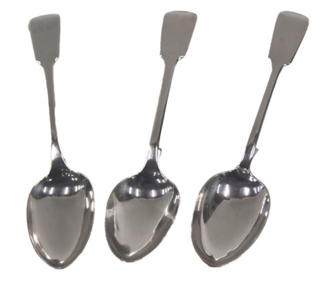 Three Victorian and later silver fiddle pattern serving spoons, one bearing the initials MAW, London 1838 and 1848, and Edinburgh 1857, 6.46oz. (3)