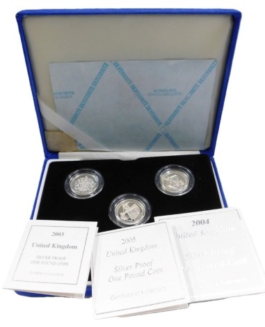 A Royal Mint silver proof one pound coin part set, comprising coins 2003, 2004 and 2005, in presentation case, with space for two additional years.