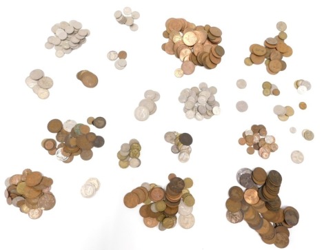 A quantity of British and foreign coins, to include a Victoria 1900 silver crown, Victoria and later pennies etc.