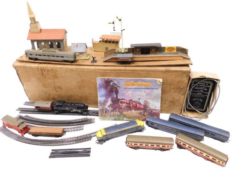 OO gauge railways, comprising buildings, loose track, transformer, various carriage and tender shells. (1 box)