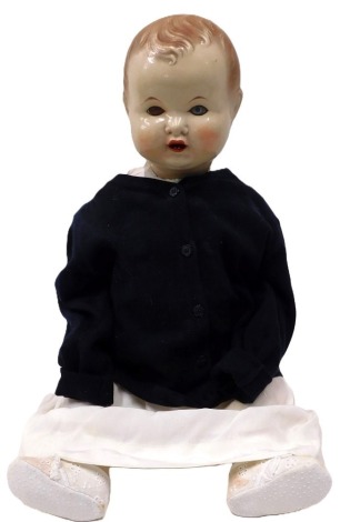 A Mattoy celluoid doll, with roll eyes and open mouth, in linen blue cardigan and shoes, stamped with M crown to head, 59cm high.