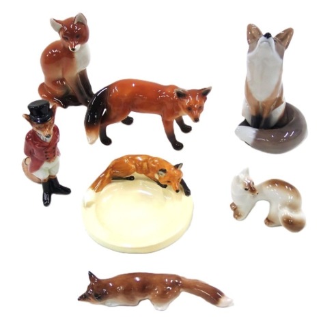 A group of Royal Copenhagen and USSR fox animals, and an ashtray.