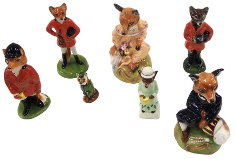 A group of boxed ceramics, comprising acorn hunting foxes, two Royal Stafford Mr & Mrs Fox, another Fox, and a Royal Stafford Fox trinket. (7)