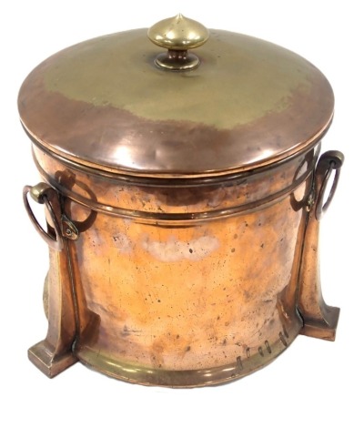 An Art Nouveau copper and brass lidded coal bin, of circular form, with swing handles, 35cm high, 30cm diameter.