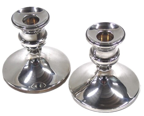 A pair of George V silver squat candlesticks, of plain design on weighted base, maker JR, Birmingham 1970, 10.75oz. (2)