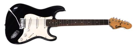 An Encore black electric guitar, 82cm long.