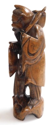 A 19thC Qing dynasty Chinese hardwood carving of a fisherman with his catch, with silver wire inlays, bone inlaid teeth, 30cm high. - 2