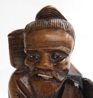 A 19thC Qing dynasty Chinese hardwood carving of a fisherman with his catch, with silver wire inlays, bone inlaid teeth, 30cm high. - 5