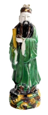 A 19thC Qing dynasty Chinese glazed figure of a scholar, 30cm high.