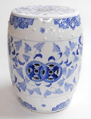 A 20thC Chinese blue and white porcelain barrel seat, of cylindrical form, decorated with raised studding and with scrolling leaf design, 47cm high. - 3