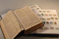 Two modern British stamp albums and a Victorian bible.